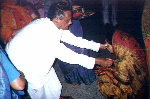 Bauji doing tel chadhana
