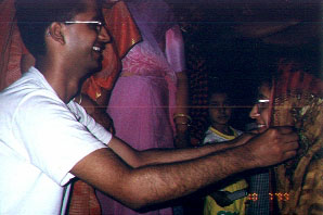 Naresh applying generously...she'll bathe after  all