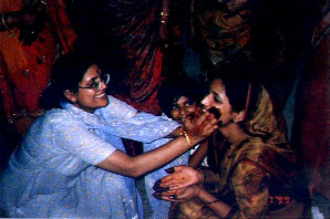 Anita didi...haldi on the cheeks..a grinning Shalu